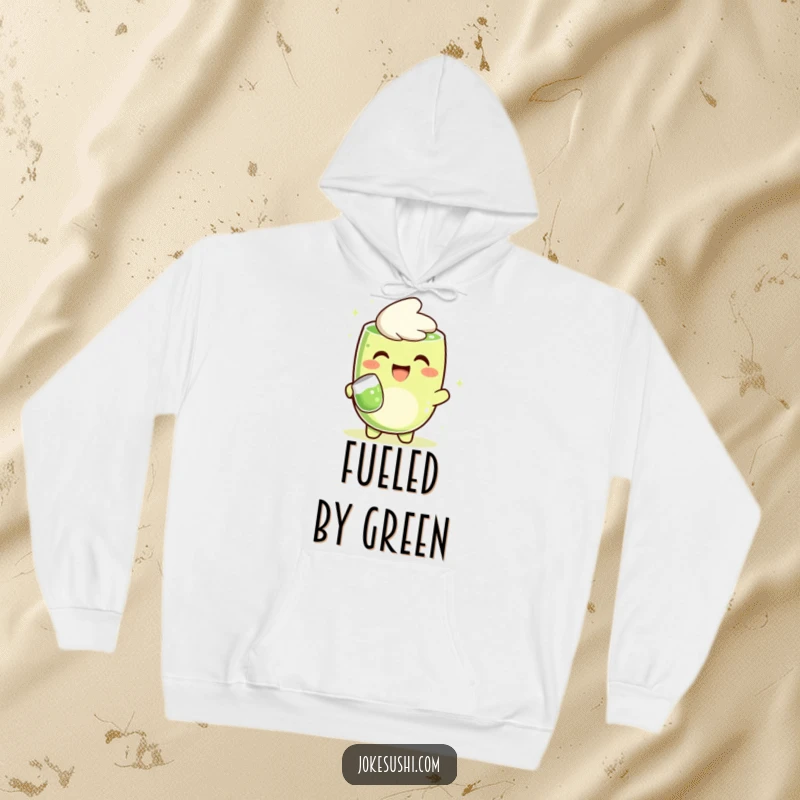 Funny hoodie with a happy matcha green tea character cheerfully pouring tea, offering warmth and humor, a perfect gift.