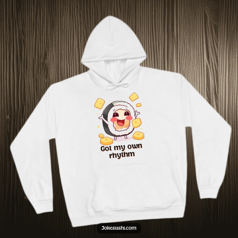 Funny hoodie featuring a smiling sushi roll character juggling ginger slices, combining warmth with delightful Japanese food humor.
