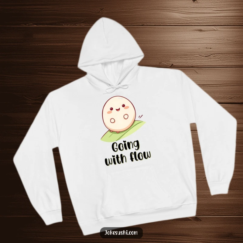 Funny Mochi Hoodie: Smiling mochi character rolling happily down a gentle slope, offering warmth and a touch of funny, smooth charm.