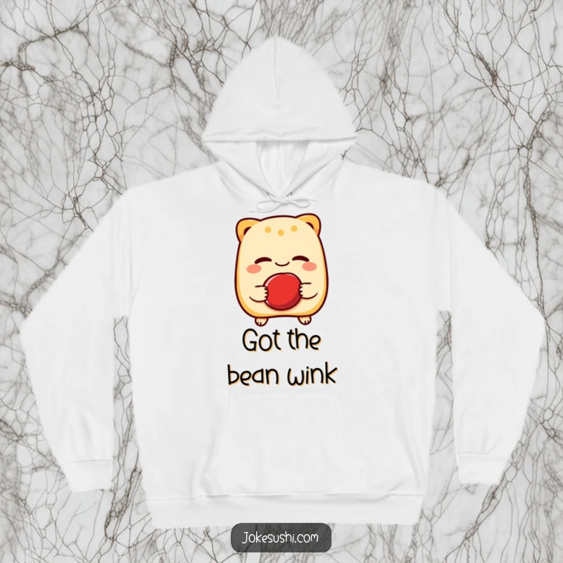 Funny hoodie illustrating a cheerful taiyaki character winking while holding a red bean, offering cozy comfort and a dose of sweet humor.