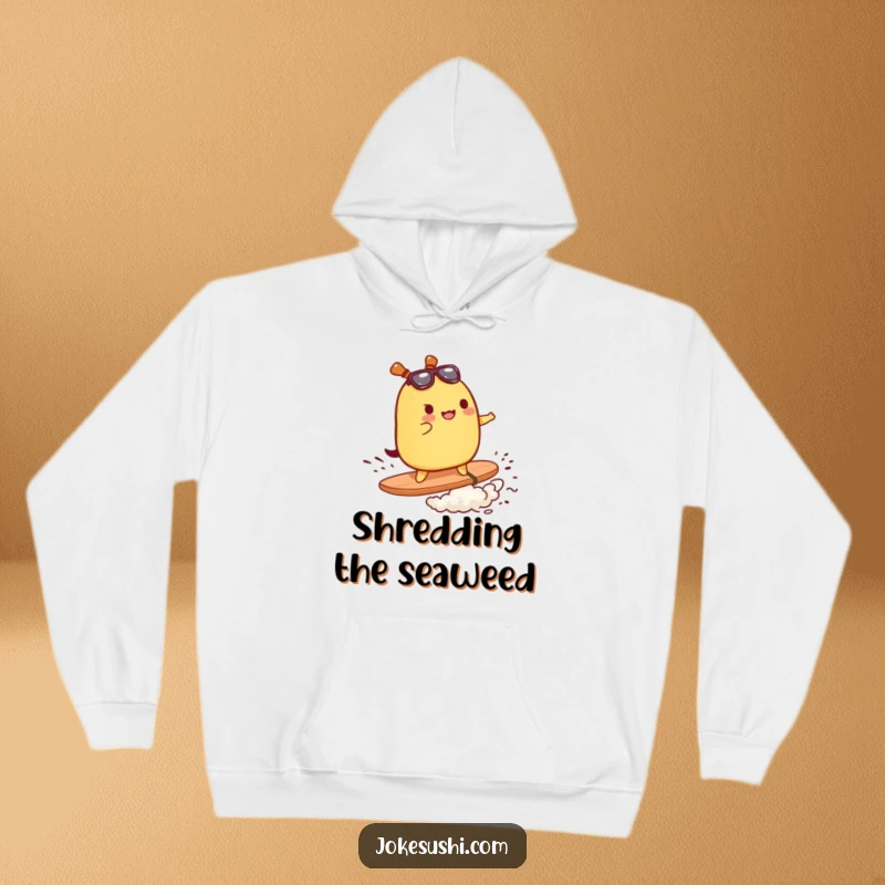 Funny hoodie depicting a tamagoyaki character surfing on a piece of nori, symbolizing food and surf adventure.