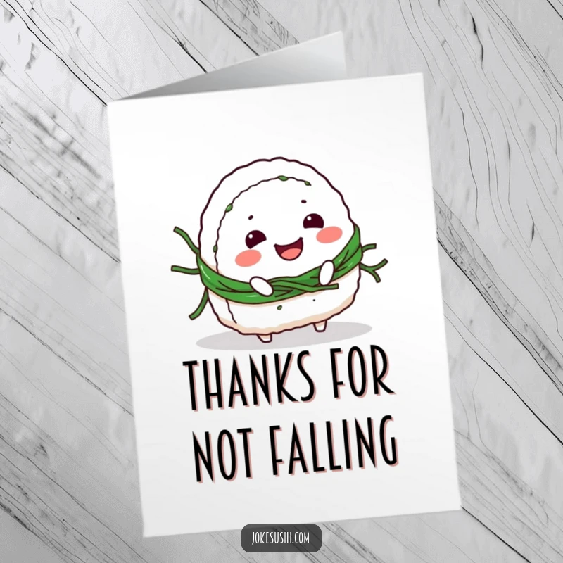 Funny Free Printable thank you card with a smiling onigiri character comically tripping over its seaweed belt, perfect for grateful greetings.
